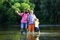 Family bonding. Father, son and grandfather fishing. Men day. Male multi generation family. Father, son and grandfather Royalty Free Stock Photo