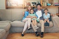 Family, bonding and parents with children, couch and relax in living room, smile and house. Home, mom and dad with kids Royalty Free Stock Photo