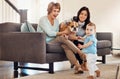 Family bonding time and everyones invited. an adorable baby girl, her mother, grandmother and their dog bonding at home. Royalty Free Stock Photo