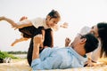 Happy family father holding small kid daughter on straight legs with mother Royalty Free Stock Photo
