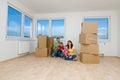 Family with boxes in new home