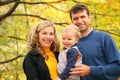 Family with boy in autumn park