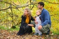 Family with boy in autumn park