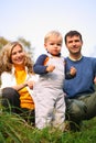 Family with boy in grass