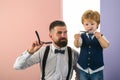 Family business. Bearded man. Barber Shop Studios. Professional hairstylist. Hairdressers work for a handsome guy at the Royalty Free Stock Photo