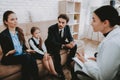Family in Bussiness Clothers with Psychologist. Royalty Free Stock Photo