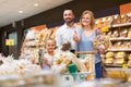 Family buying bread in food store. Royalty Free Stock Photo