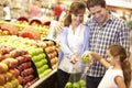Family buying fruit in supermarket Royalty Free Stock Photo