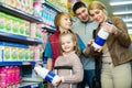 Family buying pasteurized milk in market Royalty Free Stock Photo