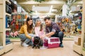 Family buying supplies for little puppy in petshop Royalty Free Stock Photo