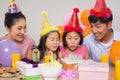 Family with cake and gifts at a birthday party Royalty Free Stock Photo