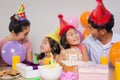 Family with cake and gifts at a birthday party Royalty Free Stock Photo