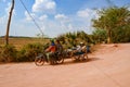 Cambodian family - father, mother, kids - on tour with motorbike