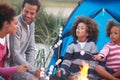 Family Camping On Beach And Toasting Marshmallows Royalty Free Stock Photo