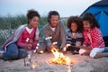 Family Camping On Beach And Toasting Marshmallows Royalty Free Stock Photo