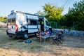 Family camping with a campervan in campsites in Greece or Croatia Royalty Free Stock Photo