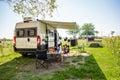 Family camping with a campervan in campsites in Greece or Croatia Royalty Free Stock Photo