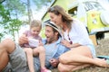 Family camping and playing video game Royalty Free Stock Photo