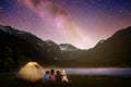 Family camping under starry sky. Night bonfire Royalty Free Stock Photo