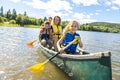 Family in a Canoe on a Lake having fun