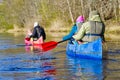 family canoeing on the river in the early morning. joint pastime, entertainment, outdoor recreation, acquaintance with Royalty Free Stock Photo