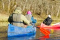 family canoeing on the river in the early morning. joint pastime, entertainment, outdoor recreation, acquaintance with Royalty Free Stock Photo