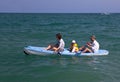 Family canoeing in the sea.