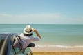 Family car trip at the sea, Asian woman feeling happiness and she looking forward to sea. Royalty Free Stock Photo