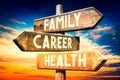 Family, career, health - wooden signpost, roadsign with three arrows