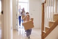 Family Carrying Boxes Into New Home On Moving Day Royalty Free Stock Photo