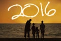 Family celebrate new year of 2016 at coast Royalty Free Stock Photo