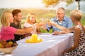 Family celebrate party picnic joyful lifestyle drinking
