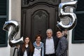 Family celebrating the 25th marriage anniversary of the parents Royalty Free Stock Photo