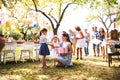 Family celebration or a garden party outside in the backyard. Royalty Free Stock Photo