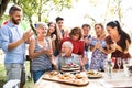 Family celebration or a garden party outside in the backyard. Royalty Free Stock Photo