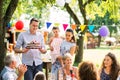 Family celebration or a garden party outside in the backyard. Royalty Free Stock Photo