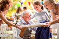 Family celebration or a garden party outside in the backyard.