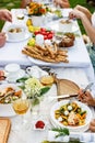 Family celebrations and food concept. The family is having dinner at a summer garden party. Table setting and decoration Royalty Free Stock Photo