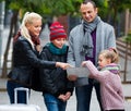 Family checking direction in map Royalty Free Stock Photo