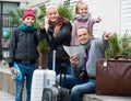 Family checking direction in map Royalty Free Stock Photo