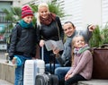 Family checking direction in map Royalty Free Stock Photo