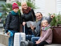 Family checking direction in map Royalty Free Stock Photo