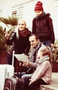 Family checking direction in map Royalty Free Stock Photo