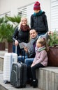 Family checking direction in map Royalty Free Stock Photo