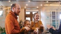 A family checking in the hotel - standing by the reception Royalty Free Stock Photo