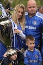 Family of Chelsea supporters holding the trophy