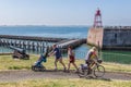 Family with child and cyclist near harbor Dutch village Vlissingen