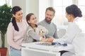 Family with child girl visiting doctor woman at clinic office. Royalty Free Stock Photo