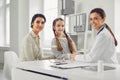 Family with child girl visiting doctor woman at clinic office. Royalty Free Stock Photo