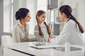 Family with child girl visiting doctor woman at clinic office. Royalty Free Stock Photo